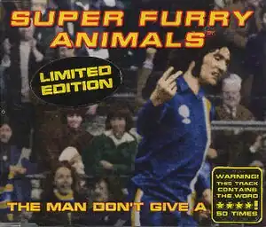 A dark-haired man in blue, white and yellow football kit scowls as he turns to his left, holding the index and middle fingers up on his right hand, his palm facing inwards. The hand points to an out-of-image figure, but appears to be pointing to the viewer. "Super Furry Animals" is rendered in yellow and red text across the top, while along the bottom the single's title is partially given: "The Man Don't Give a ****". The final word is obscured by a sticker, which itself claims that the word is used 50 times during the song