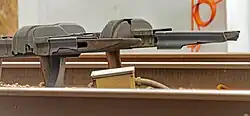 Two third rails with tips narrowing at their ends on the right
