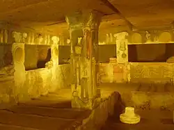 Relief details of everyday objects on the walls and columns of the Tomb of the Reliefs.