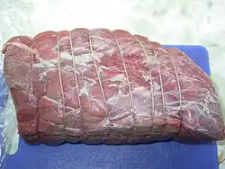 A 3 kilograms (6.6&nbsp;lb) top round roast of beef, tied and ready to be browned and roasted