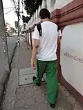 Tourist in Thailand wearing fisherman pants