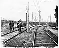 Railwaymen to work after a flooding of the Saint-Pierre River at west of the road to Côte-Saint-Paul in 1906