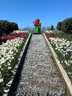 A water feature & artwork amidst the flowers