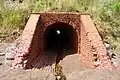 Tunnel draining Kirby Cove canyon creek through Battery Kirby