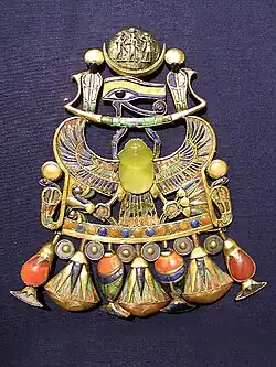 Pectoral (chest jewellery) of Tutankhamun; 1336–1327&nbsp;BC (Reign of Tutankhamun); gold, silver and meteoric glass; height: 14.9&nbsp;cm (5.9&nbsp;in); Egyptian Museum (Cairo)