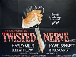 An hand holding a knife is stabbing down on a black background