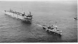 USS Oak Ridge (ARDM-1) under tow by USS Atakapa (ATF-149) arriving in Rota, Spain on 26 June 1964
