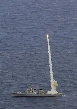 The guided-missile destroyer USS Curtis Wilbur launches a RIM-156 Standard SM-2 ER missile while conducting torpedo evasion maneuvers during Multi-Sail 2009