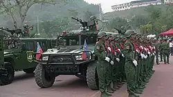UWSA female soldiers stand at attention during ceremonies