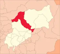 A map with the outline of several areas. There are white coloured districts stretching from the bottom left to the upper right of the image. In the middle is a red one stretching from the upper left to the lower right. It looks like a rotated 7.