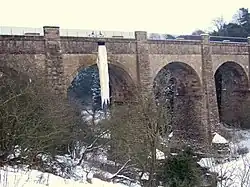 The Almond Aqueduct carrying the Edinburgh and Glasgow Union Canal over River Almond at Ratho with a frozen overflow channel during the big freeze of 2010