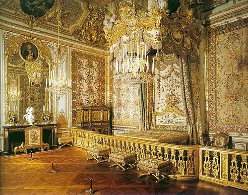 At Versailles, the Chambre de la Reine features the centrally-placed state bed delivered for Queen Maria Leszczinska.