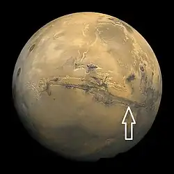 Image of disk of Mars taken by Viking. Arrow shows location of recurrent slope lineae in following HiRISE images.