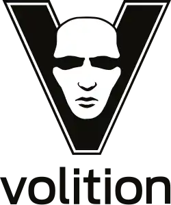 The letter "V" is displayed in black, with a white, male face shown in its center. Below the letter, the word "Volition" is rendered in lower-case letters.