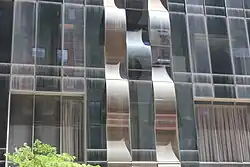 A portion of the lower-story facade of One57 with wavy vertical strips