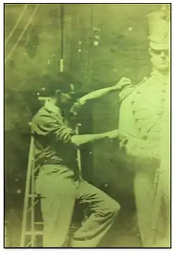John A Wilson in studio sculpting Washington Grays Monument, Boston