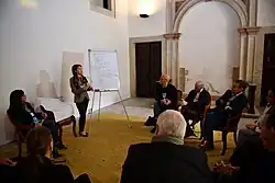 An image of people sitting together to pursue an innovative solution