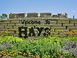 Stone work sign that greets visitors