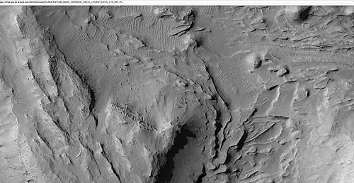 Mound showing layers at the base, east of Gale Crater
