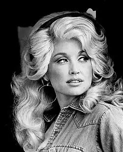 Denim jackets and headbands were also a trend, modeled here by Dolly Parton in 1977