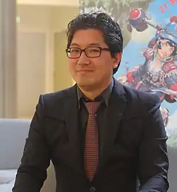 A photograph of Sonic's co-creator, Yuki Naka, in 2015
