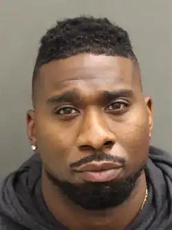 Stacy's mugshot, against a gray background