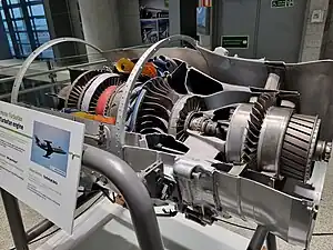 Pratt & Whitney Canada JT15D impeller with 7:1 pressure ratio would have required 6 or 7 axial stages in its place. This centrifugal stage uses pipe diffusers rather than diffuser vanes. The fan blades are not installed in the fan hub which is in front of the small booster blades.